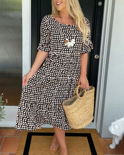 Polka Dot Midi Dress with a Round Neckline